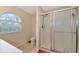 Bathroom with toilet, shower and window at 4200 Castlebridge Ln # 1924, Sarasota, FL 34238