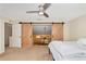 Spacious bedroom with barn doors and loft view at 4200 Castlebridge Ln # 1924, Sarasota, FL 34238