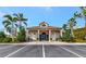 Community clubhouse with parking and landscaping at 4200 Castlebridge Ln # 1924, Sarasota, FL 34238