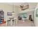 Open concept living space with dining area, kitchen, and balcony access at 4200 Castlebridge Ln # 1924, Sarasota, FL 34238