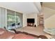 Living room with access to a balcony and adjacent laundry area at 4200 Castlebridge Ln # 1924, Sarasota, FL 34238