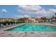 Resort-style pool with ample lounge chairs at 4200 Castlebridge Ln # 1924, Sarasota, FL 34238