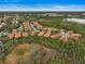 Community overview showcasing numerous homes and lush landscape at 4575 Cancello Grande Ave, Venice, FL 34293
