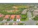 Aerial view of a community with houses and a pool at 4575 Cancello Grande Ave, Venice, FL 34293