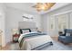 Bright bedroom with window seat and ceiling fan at 4575 Cancello Grande Ave, Venice, FL 34293