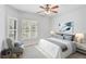 Relaxing bedroom with ceiling fan and plush bedding at 4575 Cancello Grande Ave, Venice, FL 34293