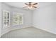 Serene bedroom with neutral carpeting and abundant light at 4575 Cancello Grande Ave, Venice, FL 34293