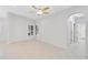 Bright dining area with tile flooring and an arched doorway at 4575 Cancello Grande Ave, Venice, FL 34293