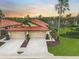Two-car garage, paver driveway, landscaped yard, inviting curb appeal at 4575 Cancello Grande Ave, Venice, FL 34293