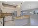 White kitchen with granite countertops and stainless steel appliances at 4575 Cancello Grande Ave, Venice, FL 34293