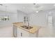 Granite kitchen island with double sink and dishwasher at 4575 Cancello Grande Ave, Venice, FL 34293