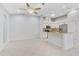 Open concept kitchen and dining room with white cabinets at 4575 Cancello Grande Ave, Venice, FL 34293