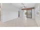 Spacious living room with tile flooring and access to a patio at 4575 Cancello Grande Ave, Venice, FL 34293