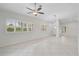 Open concept living area with tile floors and neutral walls at 4575 Cancello Grande Ave, Venice, FL 34293
