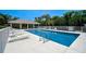 Clean and refreshing community pool with ample seating at 4575 Cancello Grande Ave, Venice, FL 34293