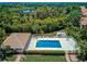 Relaxing community pool with a patio and plenty of lounge chairs at 4575 Cancello Grande Ave, Venice, FL 34293