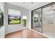 Sunroom with tiled floors, sliding glass doors, and backyard view at 4575 Cancello Grande Ave, Venice, FL 34293