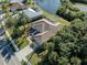 Aerial view of single-Gathering home with pool and canal-front lot at 498 Lake Of The Woods Dr, Venice, FL 34293