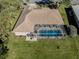 Aerial view of house, pool, and backyard at 498 Lake Of The Woods Dr, Venice, FL 34293