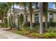 Light yellow community building with landscaping at 498 Lake Of The Woods Dr, Venice, FL 34293