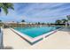 Inviting community pool with ample deck space at 498 Lake Of The Woods Dr, Venice, FL 34293