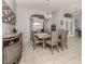 Dining room with a large table, six chairs, and a chandelier at 498 Lake Of The Woods Dr, Venice, FL 34293