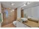 Clean bathroom with walk-in shower and granite vanity at 519 Albee Farm Rd # 115, Venice, FL 34285