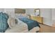 Relaxing bedroom with light teal bedding at 519 Albee Farm Rd # 115, Venice, FL 34285