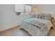 Guest bedroom with comfortable bed and light decor at 519 Albee Farm Rd # 115, Venice, FL 34285
