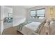Bright bedroom with a comfortable bed and access to another room at 519 Albee Farm Rd # 115, Venice, FL 34285