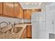 Kitchen with stainless steel sink and granite countertops at 519 Albee Farm Rd # 115, Venice, FL 34285