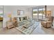 Bright living room with comfy seating and access to balcony at 519 Albee Farm Rd # 115, Venice, FL 34285