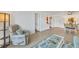 Living room with recliner and view of dining area at 519 Albee Farm Rd # 115, Venice, FL 34285