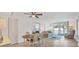 Spacious living area with dining table and balcony access at 519 Albee Farm Rd # 115, Venice, FL 34285
