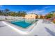 Inviting community pool area with surrounding lounge chairs at 519 Albee Farm Rd # 115, Venice, FL 34285