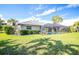 Home with pool and screened enclosure in backyard at 521 Pennyroyal Pl, Venice, FL 34293