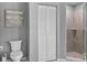 Bathroom with toilet and shower at 521 Pennyroyal Pl, Venice, FL 34293