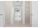 Clean bathroom with double closets and light flooring at 521 Pennyroyal Pl, Venice, FL 34293