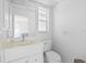 Small bathroom with toilet and sink at 521 Pennyroyal Pl, Venice, FL 34293