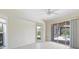 Spacious bedroom with sliding glass doors opening to a view of the pool at 521 Pennyroyal Pl, Venice, FL 34293
