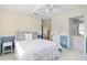 Bedroom with double bed and en-suite bathroom at 521 Pennyroyal Pl, Venice, FL 34293
