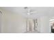 Light and airy bedroom with ceiling fan and light flooring at 521 Pennyroyal Pl, Venice, FL 34293