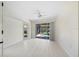 Bright bedroom with sliding doors to the pool area at 521 Pennyroyal Pl, Venice, FL 34293