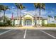 Community clubhouse with parking area at 521 Pennyroyal Pl, Venice, FL 34293