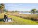 Peaceful community with lake access and park bench at 521 Pennyroyal Pl, Venice, FL 34293