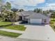 Single-Gathering house with tile roof and driveway at 521 Pennyroyal Pl, Venice, FL 34293