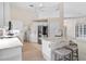 Modern kitchen with white cabinets, quartz countertops and stainless steel appliances at 521 Pennyroyal Pl, Venice, FL 34293