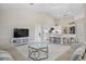 Open concept kitchen with island, stainless steel appliances, and white cabinetry at 521 Pennyroyal Pl, Venice, FL 34293