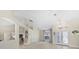 Spacious living area with light flooring, and high ceilings at 521 Pennyroyal Pl, Venice, FL 34293