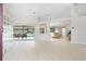 Open concept living area with high ceilings, and access to pool at 521 Pennyroyal Pl, Venice, FL 34293